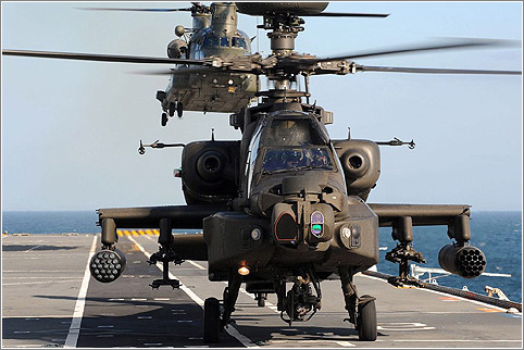 Army Air Corps Apache and RAF Chinook helicopters practise deck landings onboard HMS Illustrious. Picture: Ministry of Defence